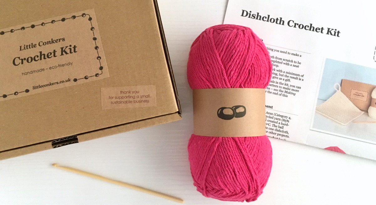 Dishcloth crochet kit in a box with bright pink yarn
