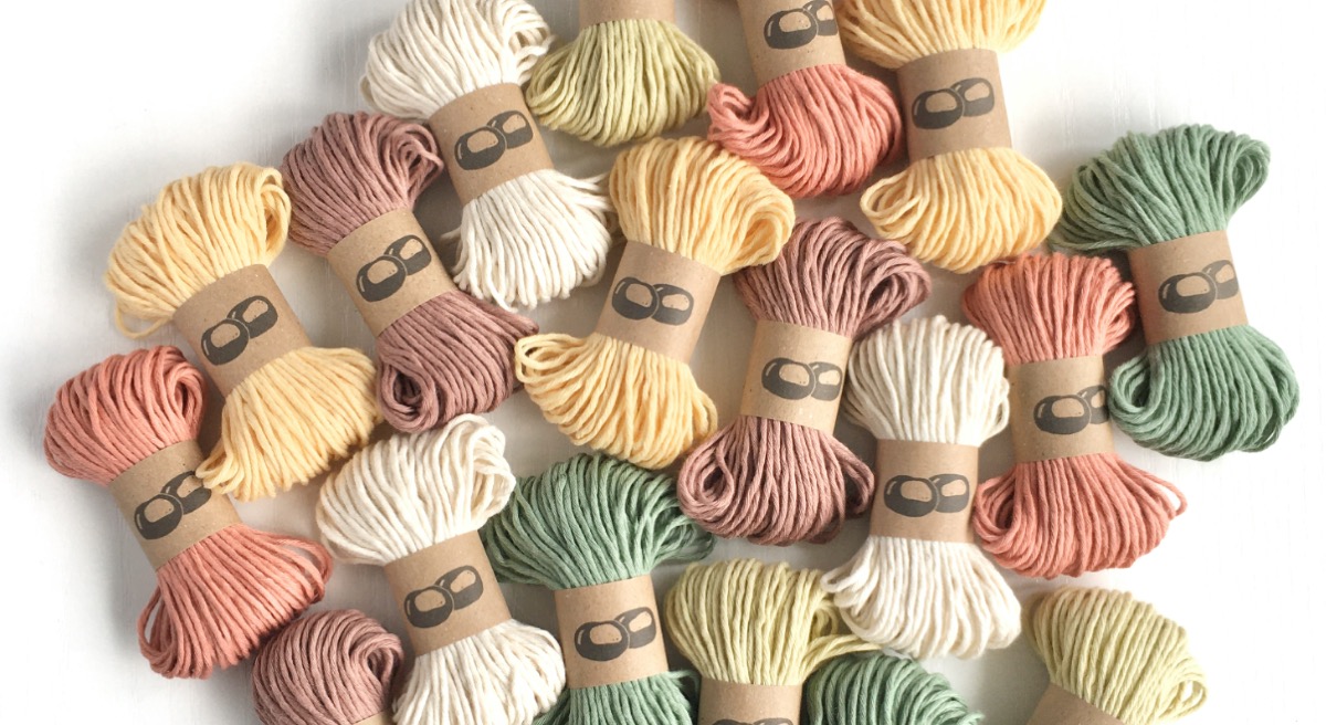 Mini-skeins of organic cotton yarn in a range of earth tones
