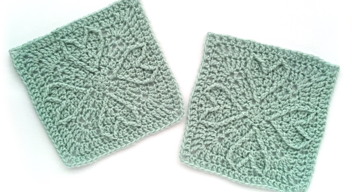 Crocheted squares with raised heart motifs